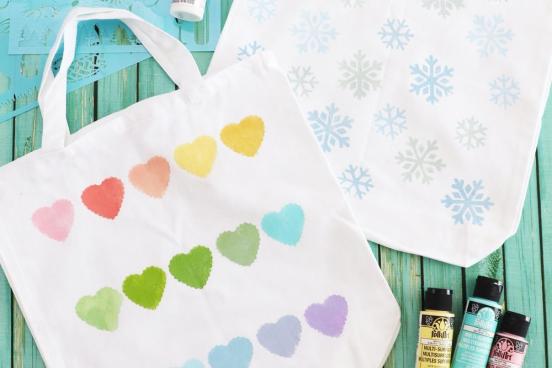 DIY Painted Tote Bags on a blue surface