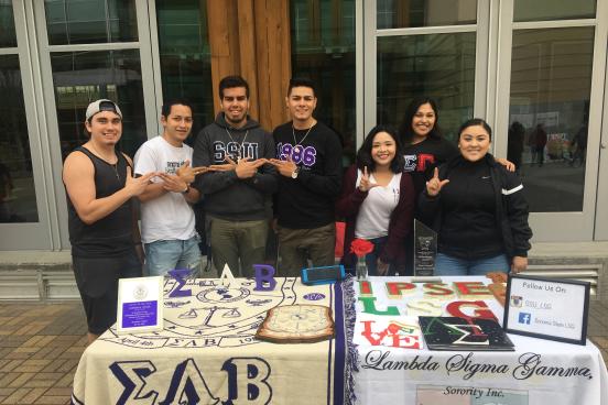 a fraternity and a sorority tabling side by side