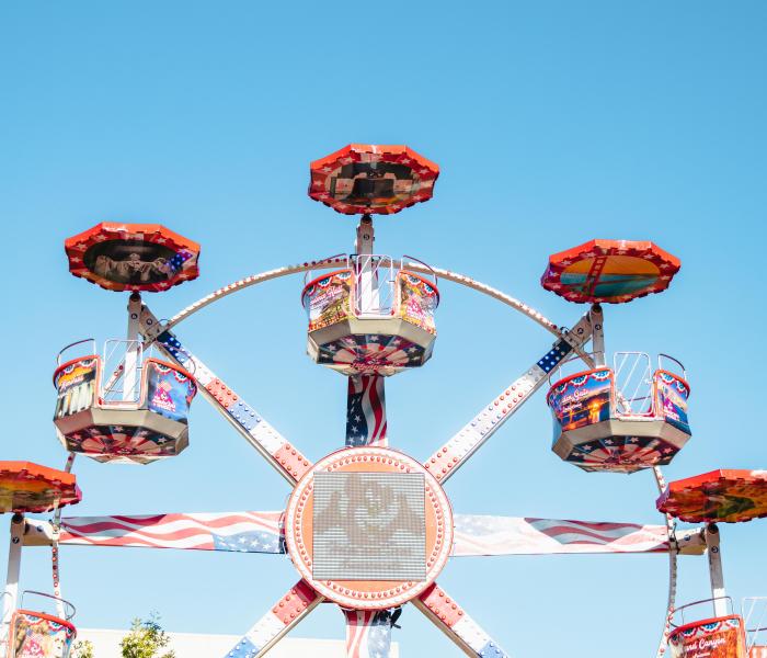 a fair ride against a blue sky