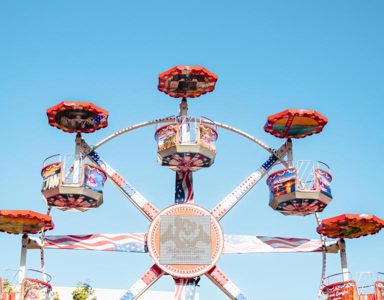 a fair ride against a blue sky