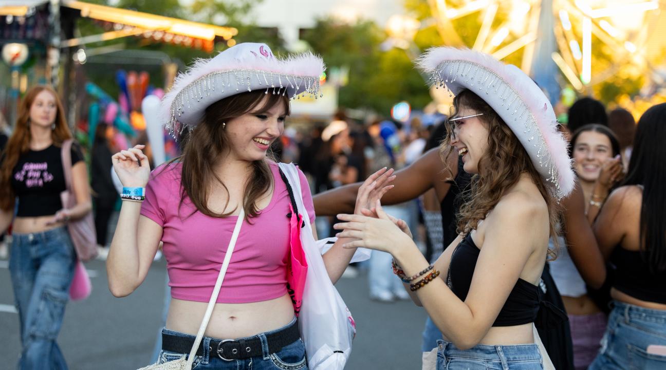 2 students with cowgirl hats.jpg
