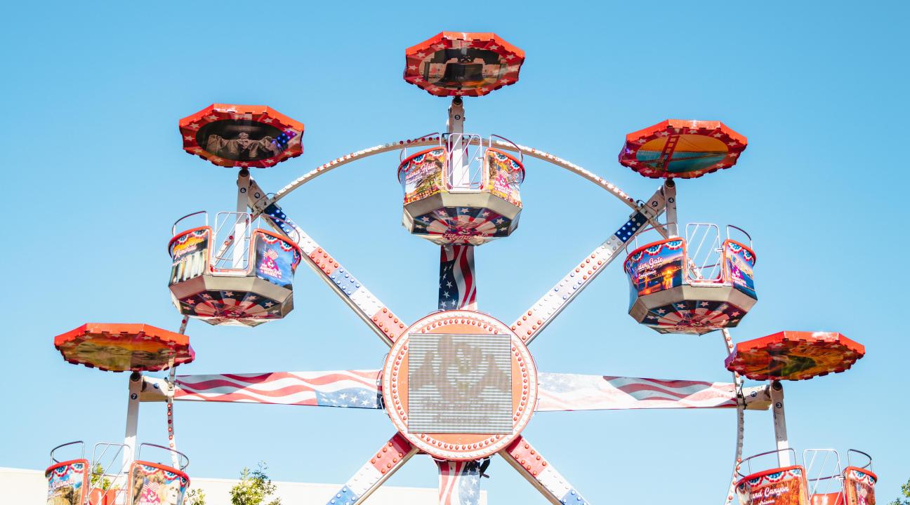 a fair ride against a blue sky