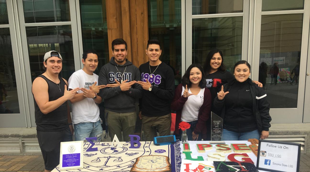 a fraternity and a sorority tabling side by side