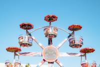 a fair ride against a blue sky