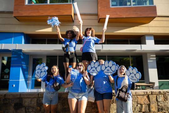 Students cheering at Potentia