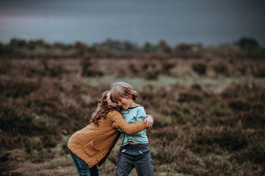 Siblings hugging