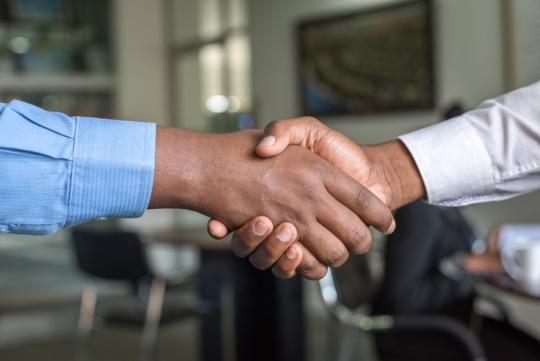 Two people shaking hands 