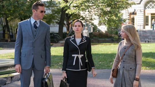 man and two women in business attire